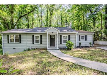 Charming single-story home with a well-manicured front yard and a welcoming entrance at 3735 Boulder Park Sw Dr, Atlanta, GA 30331