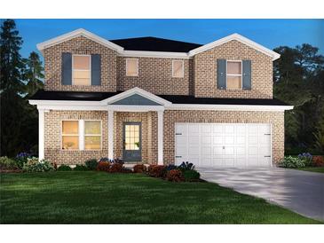 Charming two-story brick home featuring a two-car garage, a well manicured lawn, and a covered front porch at 6905 Winchester Pl, Fairburn, GA 30213