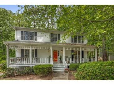Charming two-story home featuring a welcoming front porch and well-maintained landscaping at 1519 Brookcliff Cir, Marietta, GA 30062