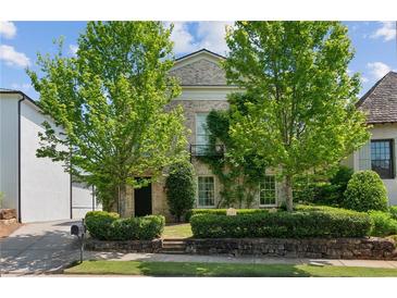 Charming two-story brick home with mature landscaping and a cozy, inviting curb appeal at 6925 Colfax Ave, Cumming, GA 30040