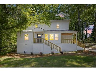 Charming two-story home with a welcoming front porch and a freshly painted exterior at 1080 Westmont Sw Rd, Atlanta, GA 30311