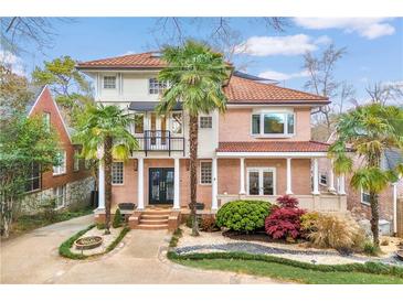 Beautiful two-story home with lush landscaping and palm trees in a desirable neighborhood at 1216 E Rock Springs Ne Rd, Atlanta, GA 30306