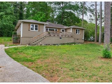 Charming single-story home with a spacious front yard and inviting entrance staircase at 1304 Anchor Sw Ter, Atlanta, GA 30311