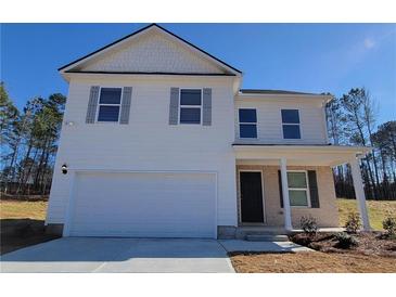 Charming two-story home with white siding, grey shutters, attached garage, and a well-manicured lawn at 2 Loth Wages (Lot 2) Rd, Dacula, GA 30019