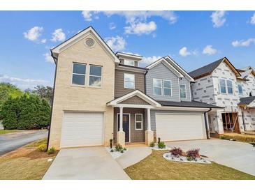 Beautiful new construction two-story home featuring a two-car garage and a welcoming entrance at 4011 Redan Rd # 7, Stone Mountain, GA 30083