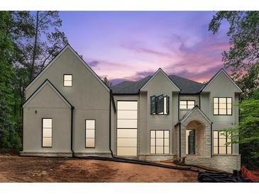 Magnificent new construction home featuring a neutral color palette and eye-catching black-trim windows at 388 Londonberry Road, Sandy Springs, GA 30327
