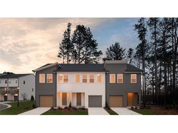 Beautiful new construction townhome with a two-car garage and welcoming curb appeal at 1724 Gunnin Nw Trce # 232, Atlanta, GA 30318