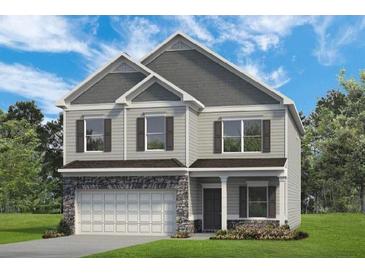 Charming two-story home featuring stone accents, gray siding, and a welcoming front porch at 323 Silver Leaf Trce, Douglasville, GA 30134