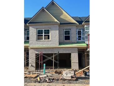 New construction two-story townhome featuring brick exterior and attached garage at 3104 Marbella Cir # 2, Kennesaw, GA 30152