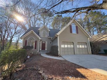Charming home featuring a two-car garage, well-maintained landscaping, and a welcoming entrance at 2887 Royal Blf, Decatur, GA 30030