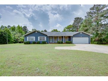 Charming ranch-style home with a well-maintained lawn and inviting curb appeal at 203 Leigh Dr, Ellenwood, GA 30294