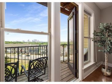 Cozy balcony with a wrought iron bench offering scenic city views, perfect for relaxation at 1195 Milton Ter # 1304, Atlanta, GA 30315