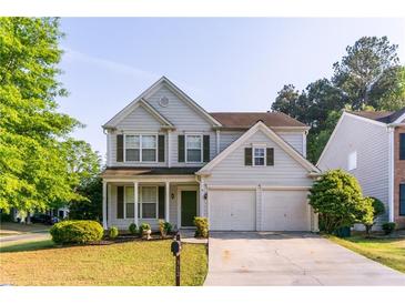 Charming two-story home with landscaped yard and two-car garage at 312 Burdock Trce, Woodstock, GA 30188