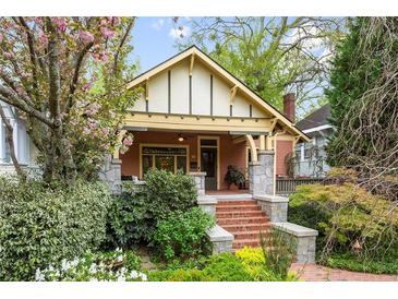 Charming craftsman-style home with a brick walkway and beautiful landscaping at 171 Westminster Ne Dr, Atlanta, GA 30309