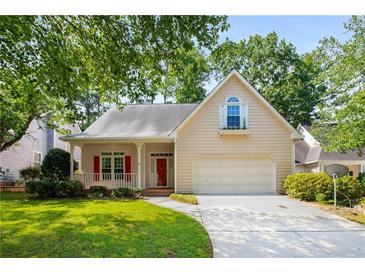Charming single-Gathering home with a well-manicured lawn, two-car garage, and inviting front porch at 4481 Mccart Cv, Stone Mountain, GA 30083