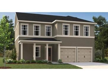 Charming two-story home with a two-car garage and a welcoming front porch at 2105 Boxwood Se Cir, Conyers, GA 30094