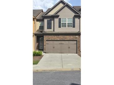 Charming two-story home features a two car garage and classic architectural details at 3456 Sardis Bend Dr, Buford, GA 30519