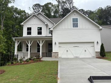 Charming new construction home with white siding, a two-car garage, and manicured lawn at 93 Riverwood Dr, Dallas, GA 30157