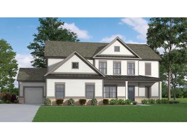 Charming two-story home featuring neutral siding, a covered front porch, and well-maintained landscaping at 1100 Cottonwood Ln, Loganville, GA 30052