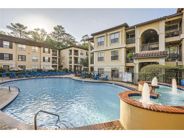Resort-style pool with fountains and lounge chairs at a luxurious apartment complex with well-maintained landscaping at 3777 Peachtree Ne Rd # 412, Brookhaven, GA 30319