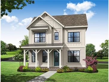Charming two-story home featuring a welcoming front porch, well-maintained lawn, and tasteful landscaping at 520 Pearl St, Cumming, GA 30040