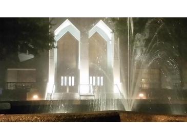 An eye-catching building entrance is illuminated and features a beautiful water feature in the foreground at 2870 Pharr Court South Nw # 901, Atlanta, GA 30305