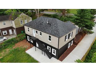 Modern two-story home featuring neutral siding, black trim, and a newly installed roof for enhanced curb appeal at 788 Fayetteville Se Rd, Atlanta, GA 30316