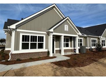 Charming new construction home with modern architecture, manicured lawn and inviting entrance at 1802 Bonica Xing # 1802, Cumming, GA 30040