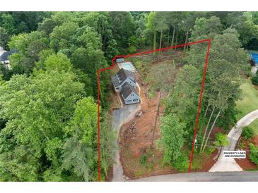 Areal view of lovely home on a sprawling lot surrounded by mature trees and featuring a private pool at 61 Sherwood Se Ln, Marietta, GA 30067