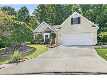 Charming one-story home with manicured landscaping and a two-car garage at 2700 White Blossom Ln, Suwanee, GA 30024