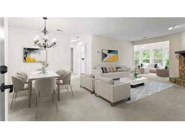 Spacious living room featuring modern furniture and a cozy fireplace, perfect for entertaining guests at 1214 Lake Pointe Cir, Roswell, GA 30075