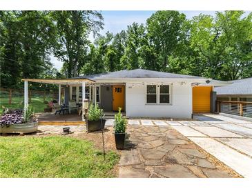 Charming single-story home with a covered porch, manicured lawn, and walkway at 435 Mcwilliams Se Ave, Atlanta, GA 30316