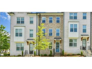 Townhome featuring painted brick and visible address number at 3313 Bartee Walk, Suwanee, GA 30024