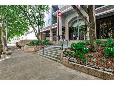 Condominium building with nicely landscaped entrance, exterior shot at 275 13Th Ne St # 605, Atlanta, GA 30309