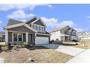 Beautiful two-story home with a well-manicured lawn and a two-car garage in a desirable neighborhood at 2349 Hanover Woods Rd, Lithonia, GA 30058