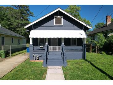 Charming one-story home with blue siding, covered porch, and well-maintained front lawn at 1286 Allene Sw Ave, Atlanta, GA 30310