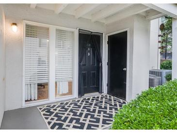 Inviting entryway with a stylish rug and natural light streaming through the adjacent window at 1150 Collier Nw Rd # 25D, Atlanta, GA 30318
