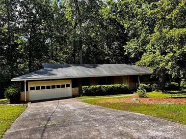 Charming ranch home featuring mature landscaping and a two-car garage at 2636 Whiteleigh Ne Ct, Atlanta, GA 30345