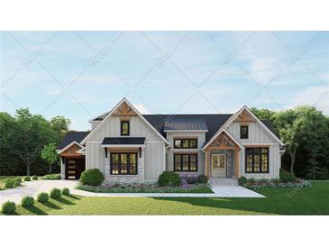 Charming craftsman-style home with stone accents, gabled roof, and well-manicured landscaping at 2468 Rockbridge Nw Rd, Conyers, GA 30012