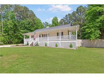 Charming ranch home with a welcoming front porch and a well-manicured lawn at 37 Winesap Ct, Temple, GA 30179