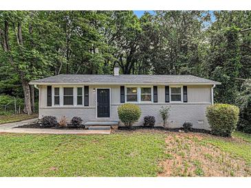 Charming single-story home with a well-manicured front yard and classic black shutters at 442 Cologne Se Dr, Atlanta, GA 30354