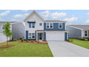 Charming two-story home featuring a blue and white exterior with a manicured lawn at 107 Cherry Glen Way, Euharlee, GA 30145