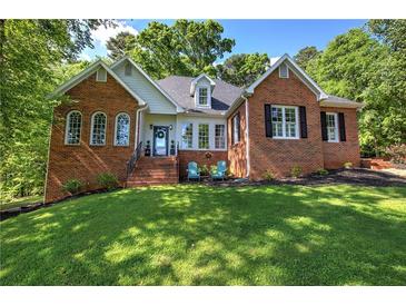 Charming brick home with a landscaped front yard and inviting entrance at 3695 Highway 140, Rydal, GA 30171