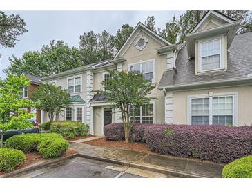 Charming townhouse featuring well-manicured landscaping and neutral exterior paint at 3733 Sidney Lanier Blvd, Duluth, GA 30096