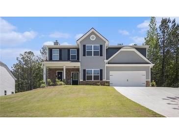 Charming two-story home with gray siding, black shutters, and a well-manicured front lawn at 458 Ajo Way, Dallas, GA 30157