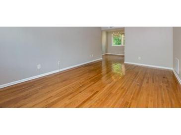 Bright living room features gleaming hardwood floors and ample natural light at 100 Biscayne Nw Dr # D7, Atlanta, GA 30309