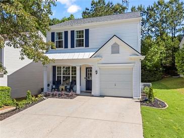 Charming two-story home with a well-manicured lawn and a welcoming front porch area at 11255 Wittenridge Dr, Alpharetta, GA 30022