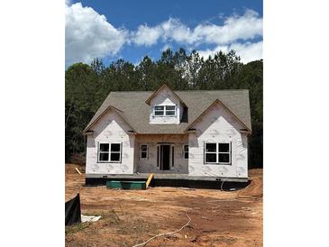 New construction home with a modern roof and windows ready for finishing touches and landscaping at 70 Oxford Rd, Oxford, GA 30054
