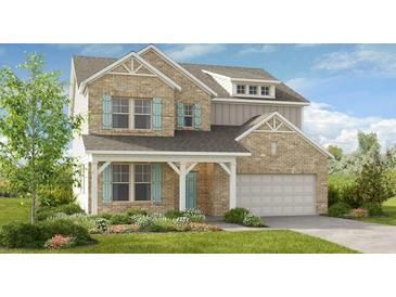 Charming two-story brick home with blue shutters, manicured landscaping, and an attached two-car garage at 3248 Shirecrest Ln, Dacula, GA 30019
