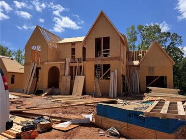 New construction home showing framing and wooden building materials at 6740 Pannell Rd, Buford, GA 30518